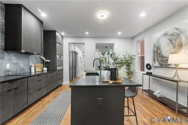 a kitchen with counter top space cabinets and stainless steel appliances