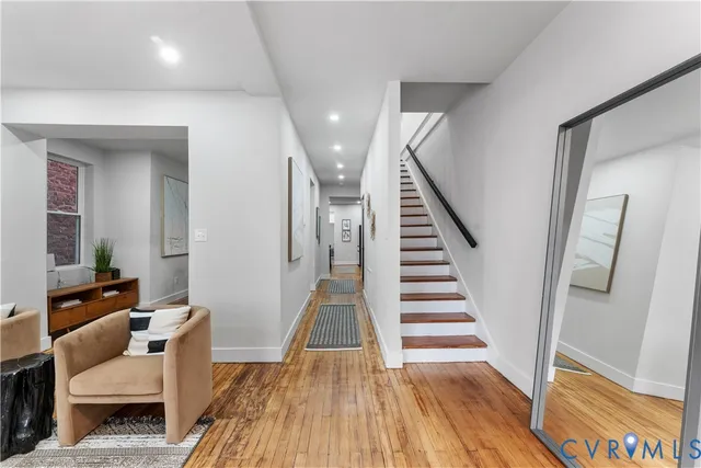 a view of a living room and wooden floor