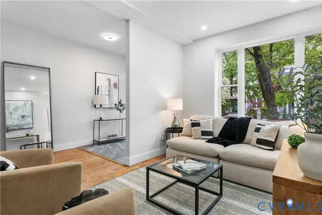 a living room with furniture and a large window