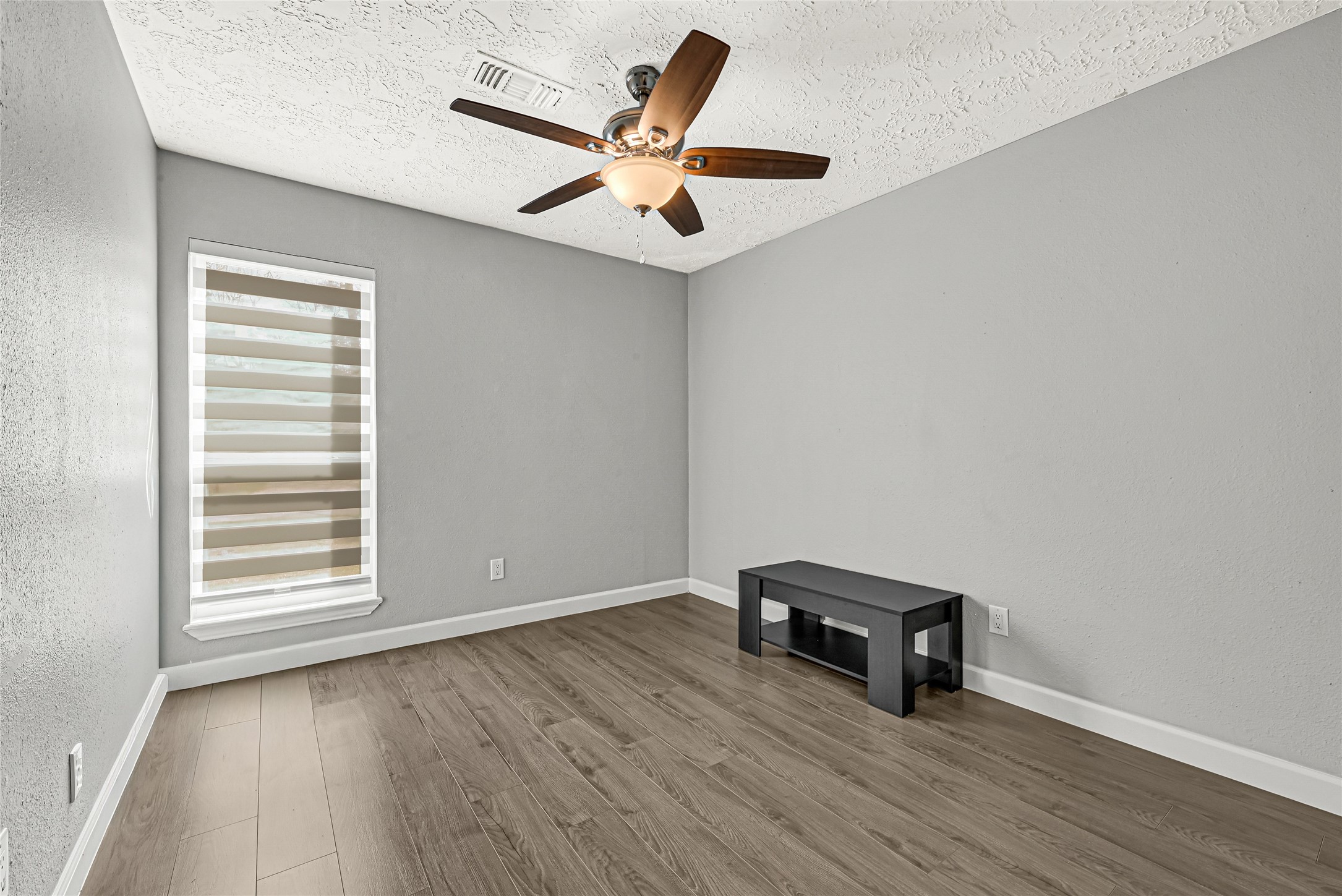 2407 Rambling Brook Drive Spring, TX 77373 - Photo 8 of 49 Serene sanctuary. A spacious, sun-drenched bedroom built for ultimate comfort.