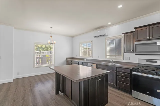 a kitchen with a stove sink and microwave