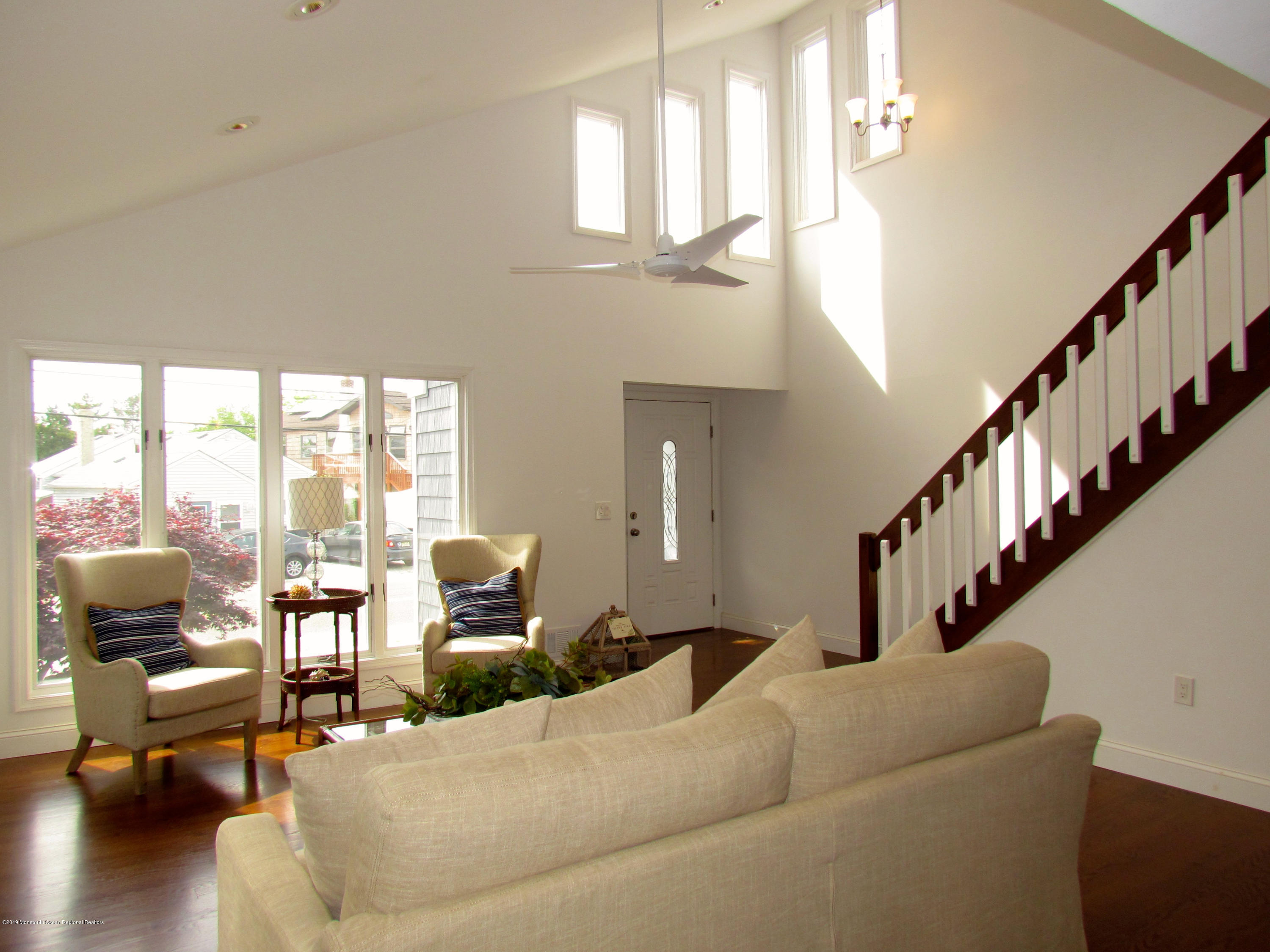 706 Drum Point Road Brick, NJ 08723 - Photo 20 of 39 a living room with furniture or wooden floor and a large window