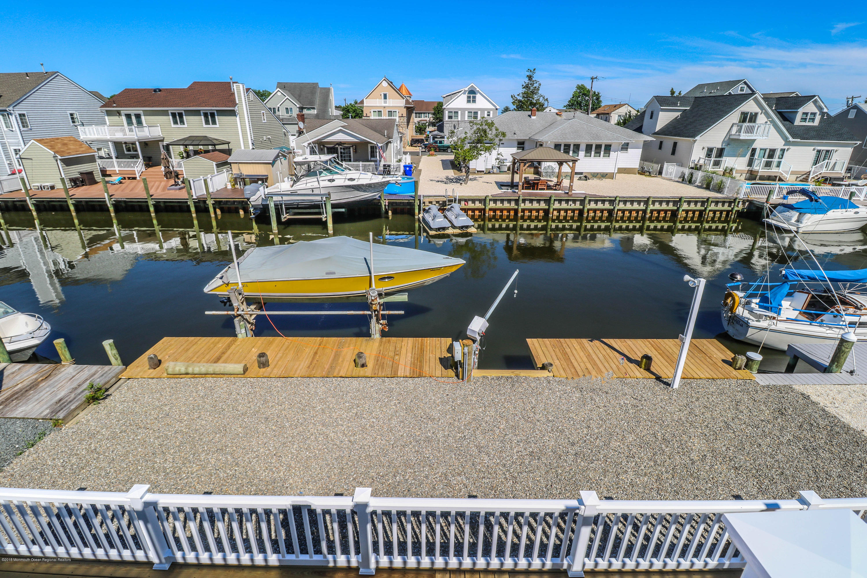 706 Drum Point Road Brick, NJ 08723 - Photo 7 of 39 a terrace with outdoor seating and city view