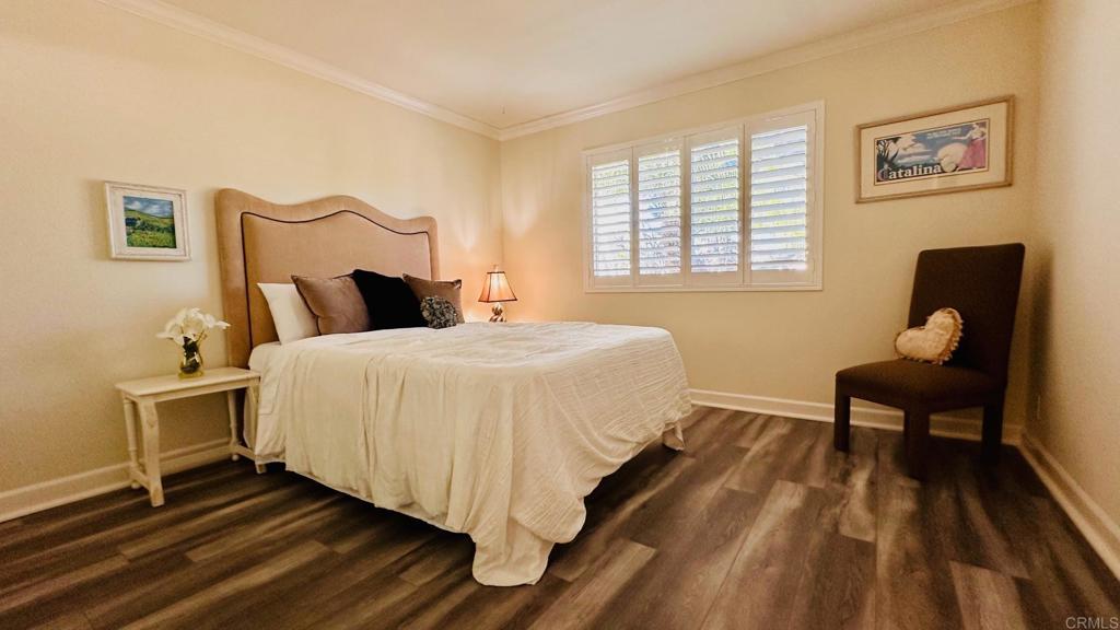1034 Turnstone Way Oceanside, CA 92057 - Photo 14 of 28 a bedroom with a bed and wooden floor