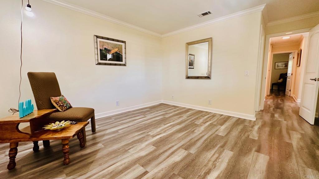 1034 Turnstone Way Oceanside, CA 92057 - Photo 14 of 25 a workspace with wooden floor and furniture
