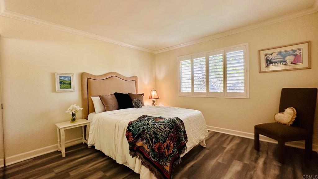 1034 Turnstone Way Oceanside, CA 92057 - Photo 16 of 28 a bedroom with a bed chair and a window