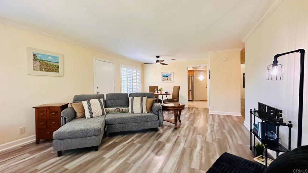 1034 Turnstone Way Oceanside, CA 92057 - Photo 19 of 28 a living room with furniture and a flat screen tv