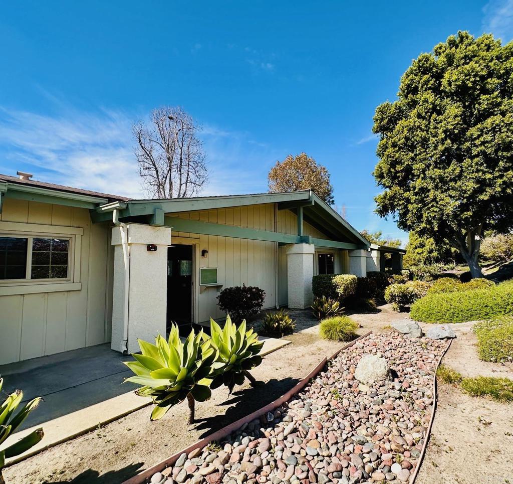 1034 Turnstone Way Oceanside, CA 92057 - Photo 22 of 28 a front view of a house with a yard outdoor seating and covered with furniture