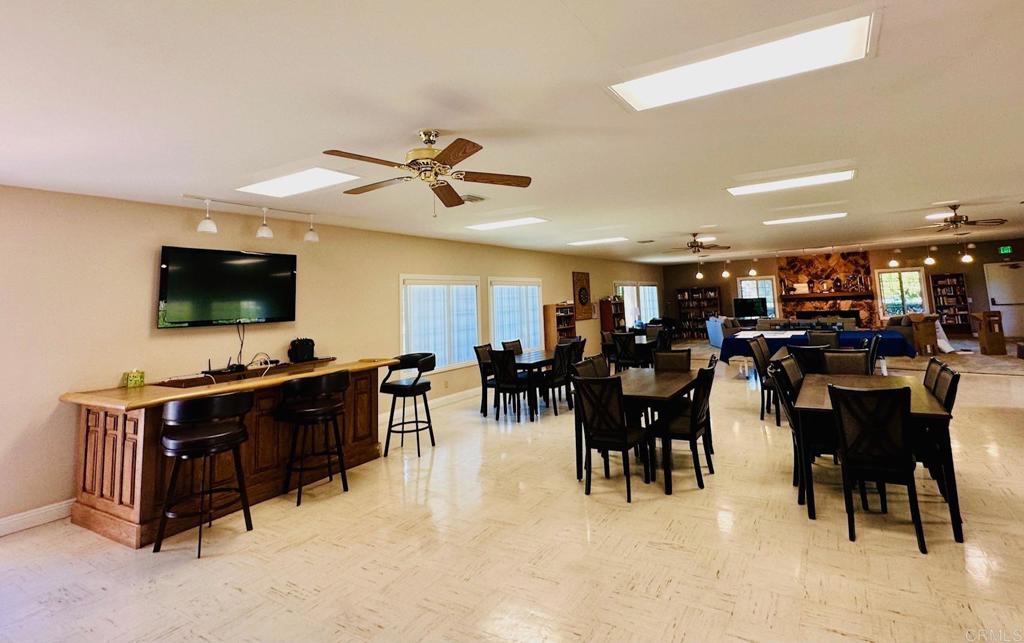 1034 Turnstone Way Oceanside, CA 92057 - Photo 23 of 28 a living room with lots of furniture and kitchen view