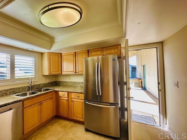 1034 Turnstone Way Oceanside, CA 92057 - Photo 24 of 25 a kitchen with stainless steel appliances granite countertop a refrigerator a sink and a stove with wooden floors