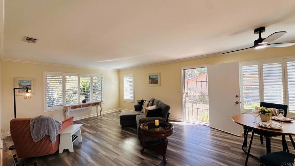 1034 Turnstone Way Oceanside, CA 92057 - Photo 7 of 25 a living room with furniture and wooden floor