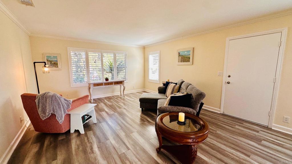 1034 Turnstone Way Oceanside, CA 92057 - Photo 8 of 25 a living room with furniture a window and a lamp