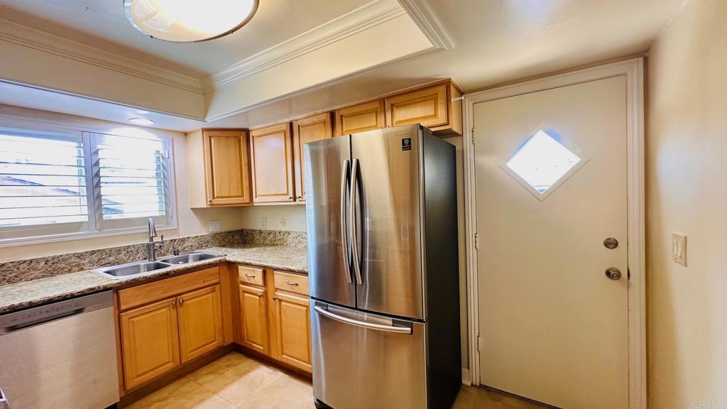 1034 Turnstone Way Oceanside, CA 92057 - Photo 8 of 28 a kitchen with a refrigerator and a sink