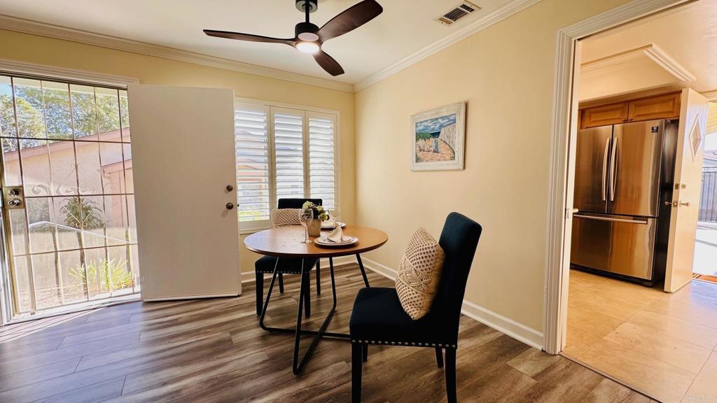 1034 Turnstone Way Oceanside, CA 92057 - Photo 9 of 28 a view of a dining room with furniture window and wooden floor