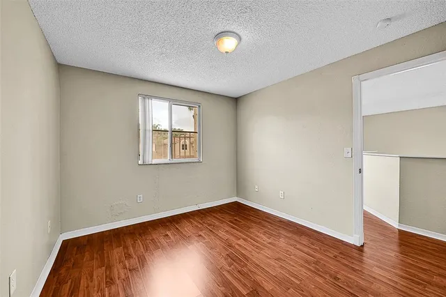 a bathroom with a double vanity sink toilet and shower