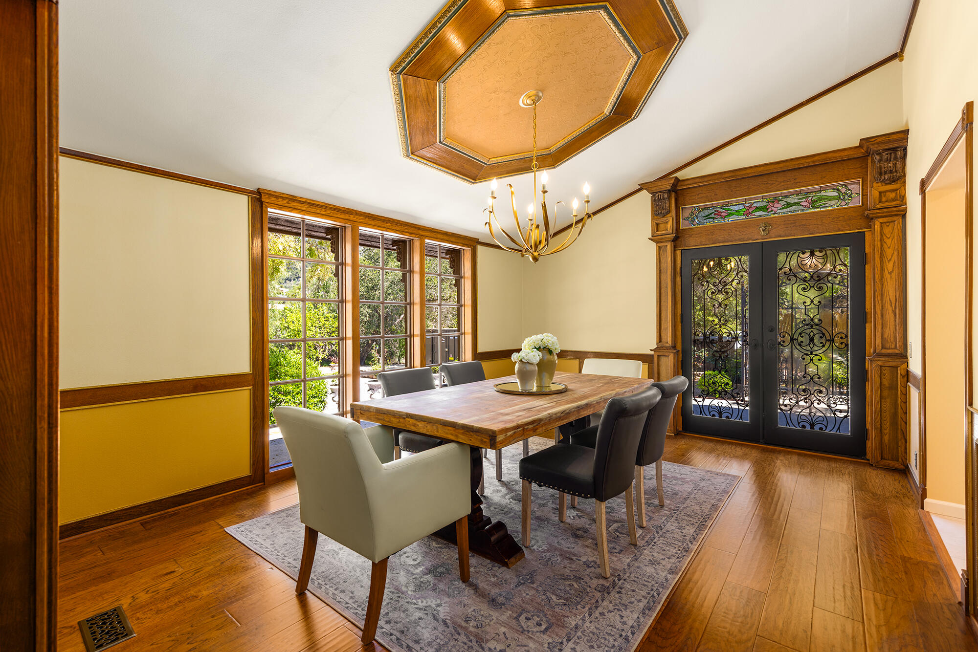 10480 Creek Road Oak View, CA 93022 - Photo 13 of 52 a dining room with furniture and wooden floor