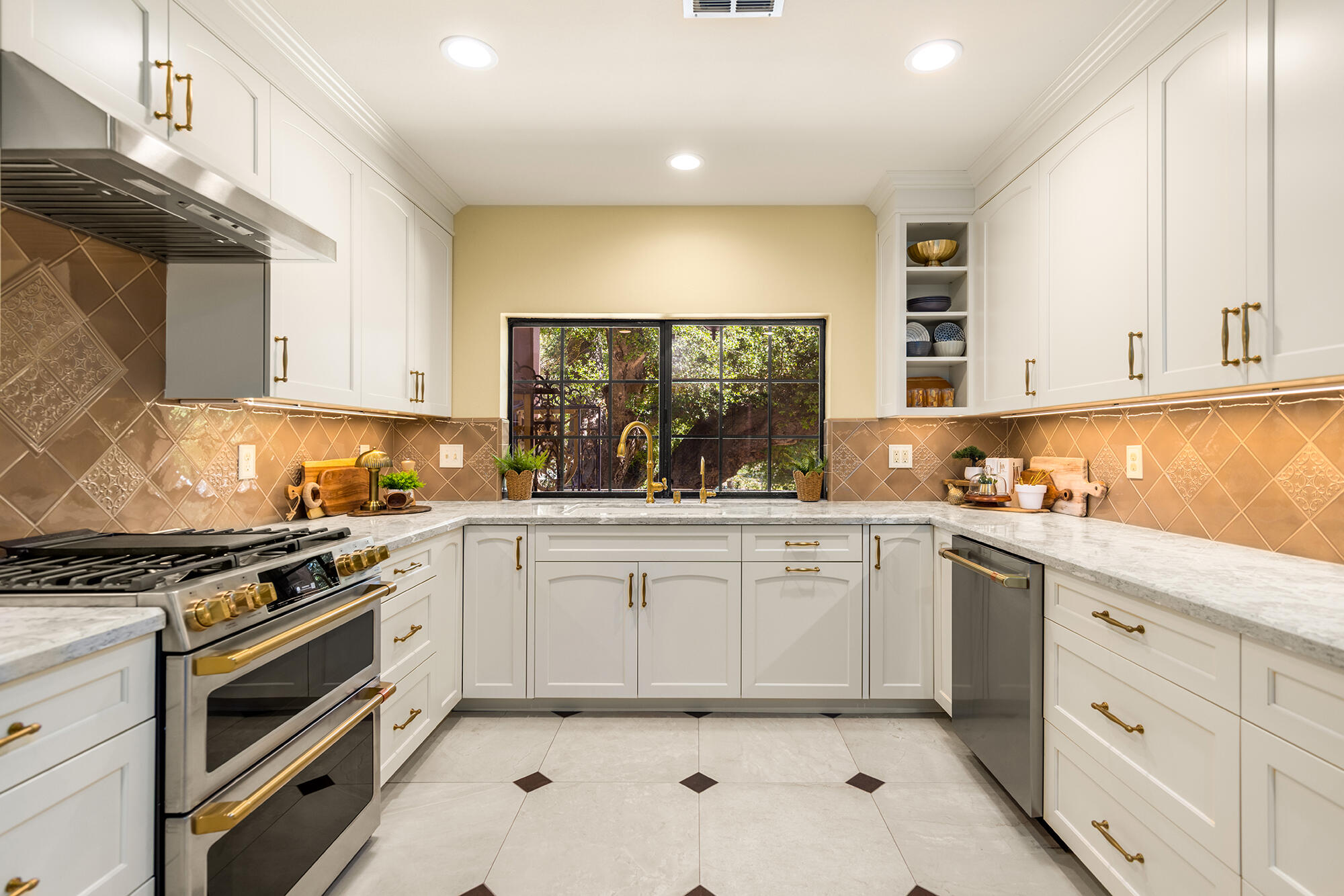 10480 Creek Road Oak View, CA 93022 - Photo 16 of 52 a kitchen with granite countertop white cabinets and white appliances