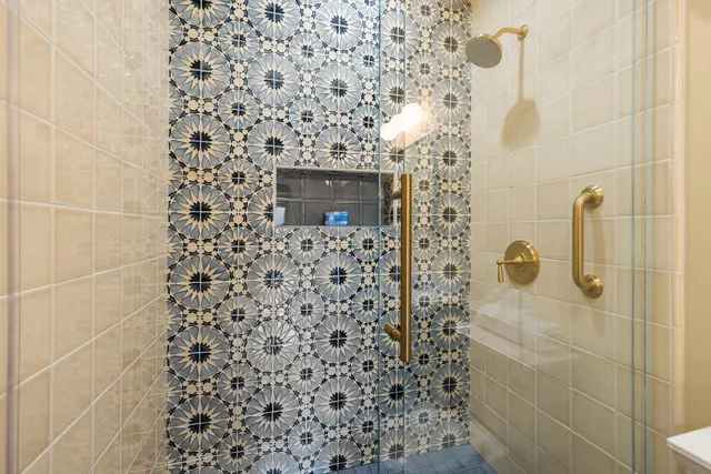 a bathroom with a shower and a shower