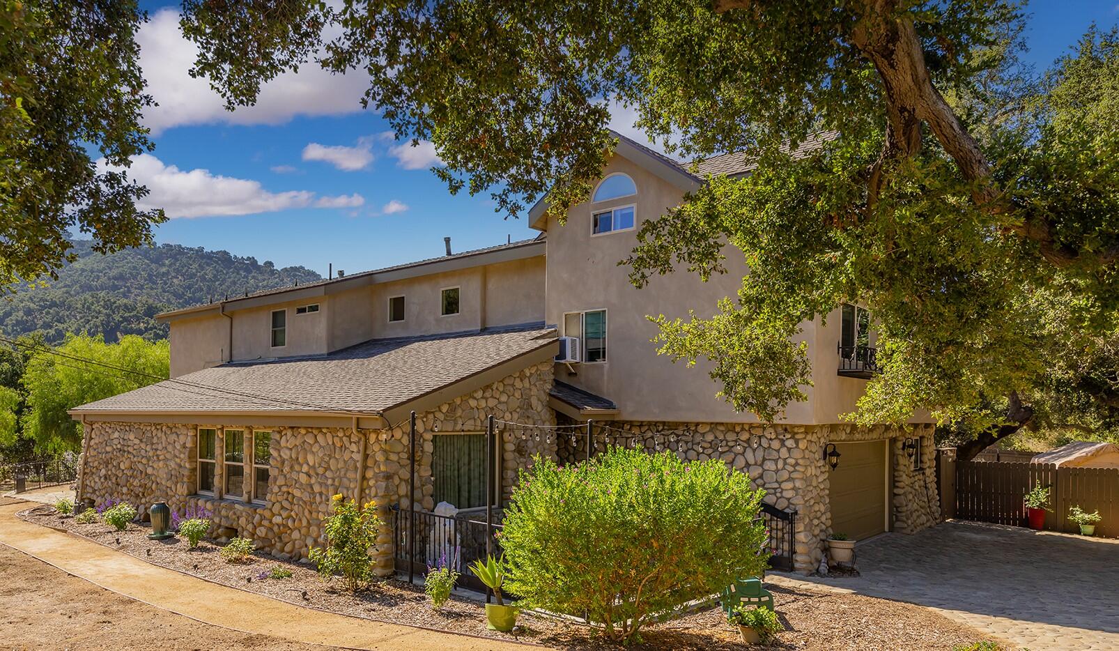 10480 Creek Road Oak View, CA 93022 - Photo 3 of 52 a house with trees in front of it
