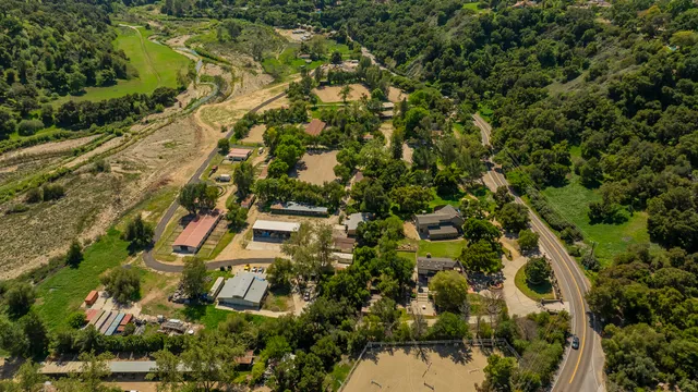 an aerial view of residential houses with outdoor space