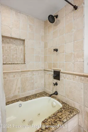 a bathroom with a bath tub