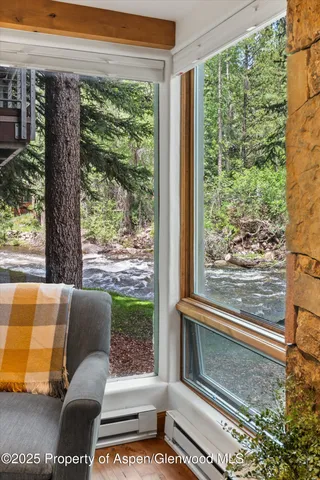 a view of a floor to ceiling window and a yard