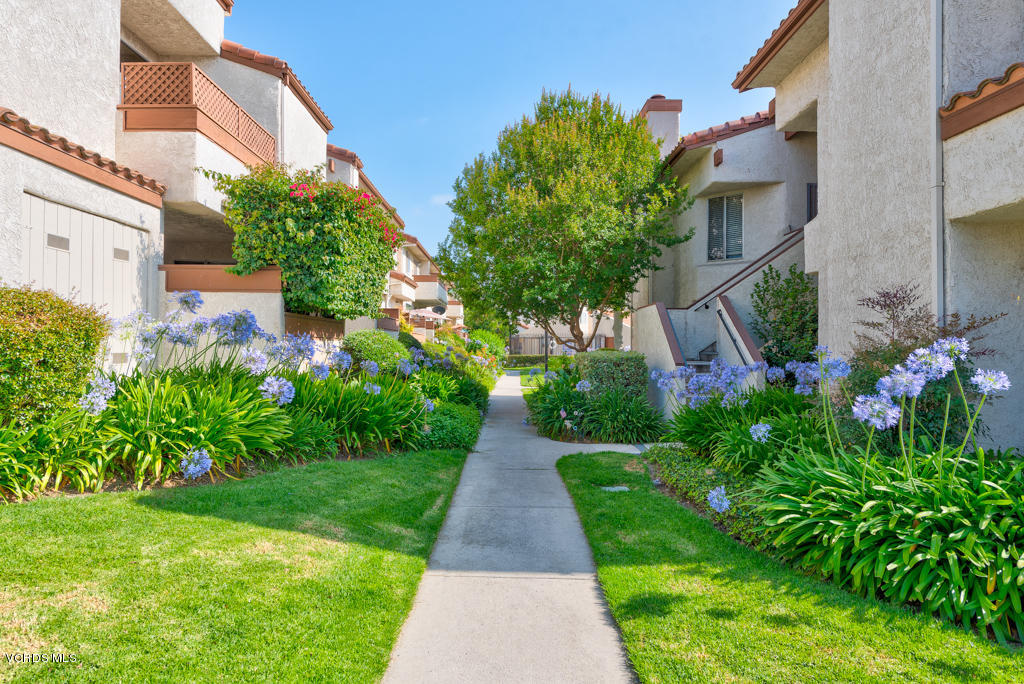1730 Sinaloa Road, Unit 312 Simi Valley, CA 93065 - Photo 2 of 24 a view of a pathway with house on both side