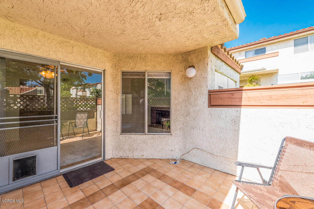 1730 Sinaloa Road, Unit 312 Simi Valley, CA 93065 - Photo 20 of 24 a view of a house with a backyard and balcony