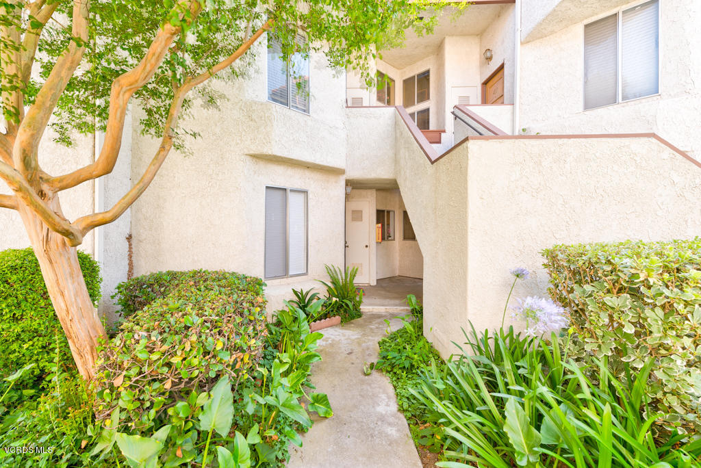 1730 Sinaloa Road, Unit 312 Simi Valley, CA 93065 - Photo 3 of 24 a front view of a house with garden