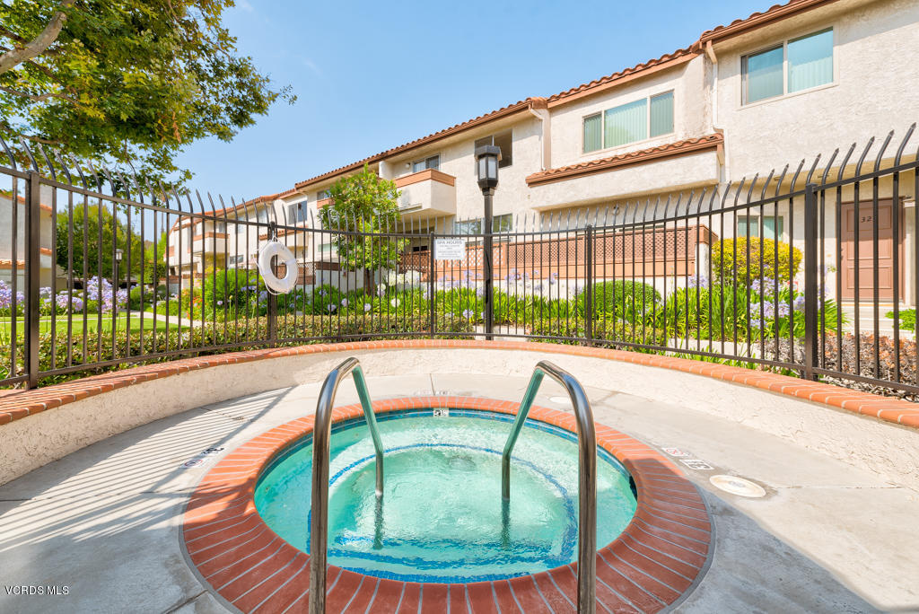 1730 Sinaloa Road, Unit 312 Simi Valley, CA 93065 - Photo 22 of 24 a view of a house with a swimming pool
