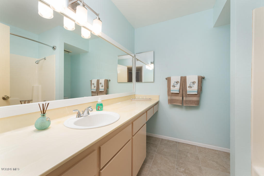 1730 Sinaloa Road, Unit 312 Simi Valley, CA 93065 - Photo 10 of 24 a bathroom with a sink vanity and a mirror