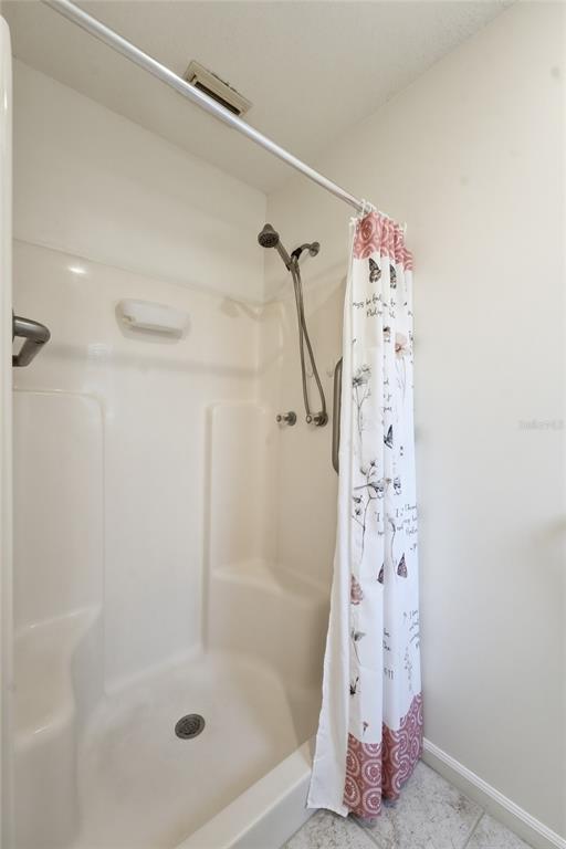 5930 Foxtail Way Fort Pierce, FL 34982 - Photo 17 of 47 a bathroom with a shower