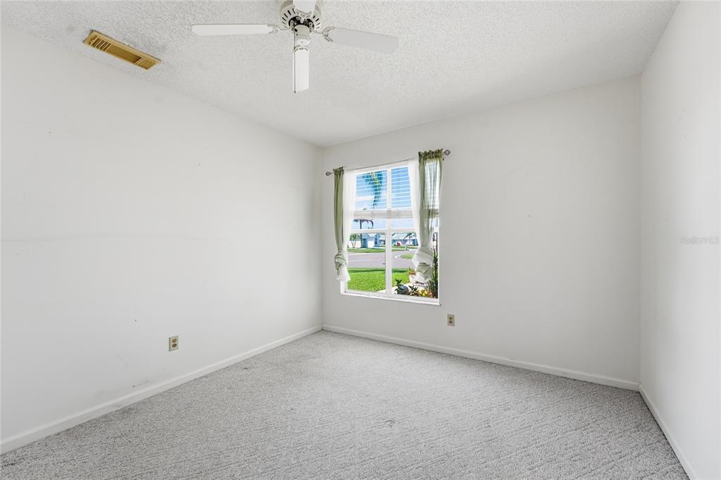 5930 Foxtail Way Fort Pierce, FL 34982 - Photo 18 of 47 an empty room with a empty space and a window