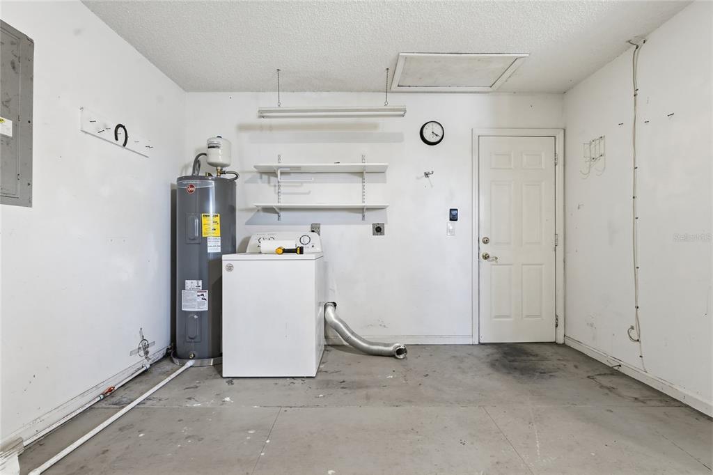 5930 Foxtail Way Fort Pierce, FL 34982 - Photo 22 of 47 a view of a storage & utility room with washer and dryer