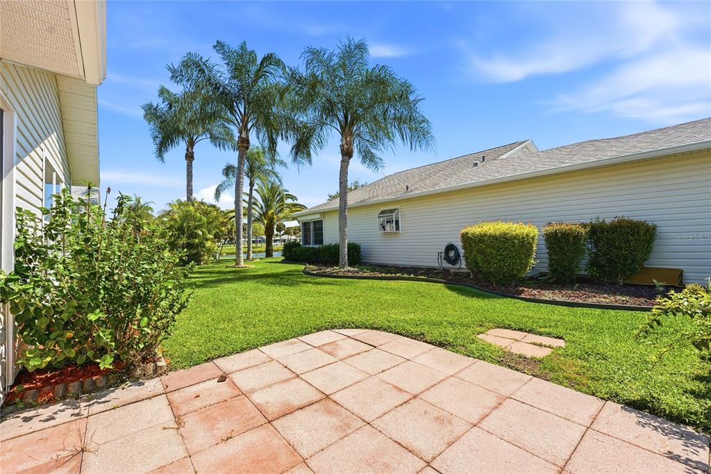5930 Foxtail Way Fort Pierce, FL 34982 - Photo 26 of 47 a couple of palm trees sitting in front of a house with a yard