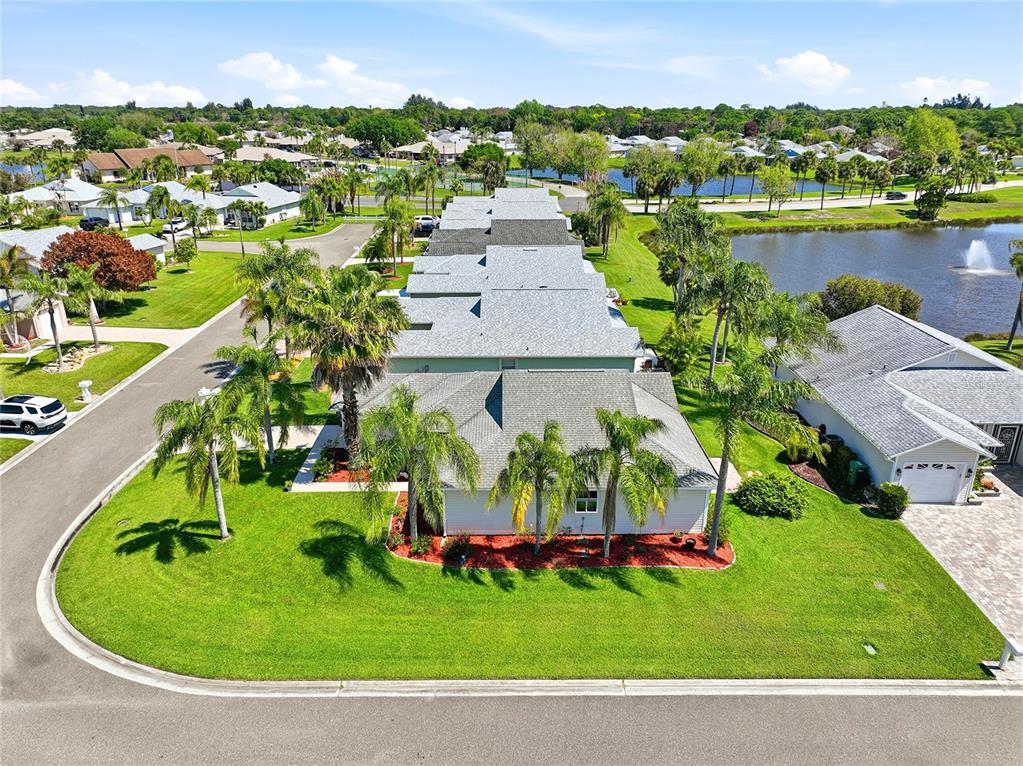 5930 Foxtail Way Fort Pierce, FL 34982 - Photo 30 of 47 an aerial view of a house with a garden and lake view