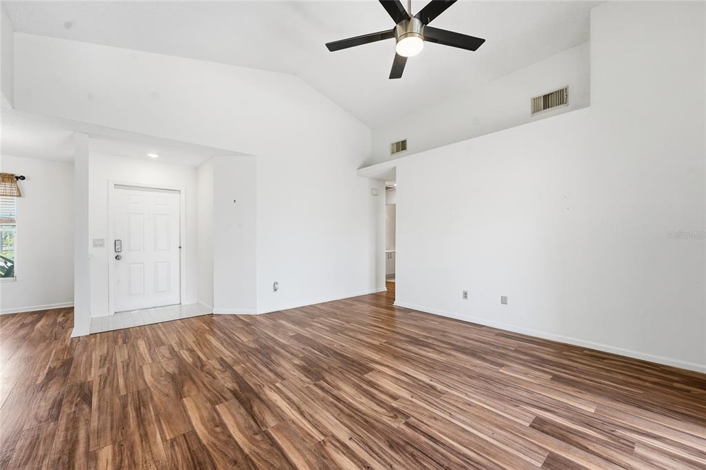 5930 Foxtail Way Fort Pierce, FL 34982 - Photo 6 of 47 a view of a room with wooden floor