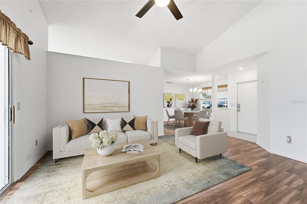 5930 Foxtail Way Fort Pierce, FL 34982 - Photo 8 of 47 a living room with furniture and a rug