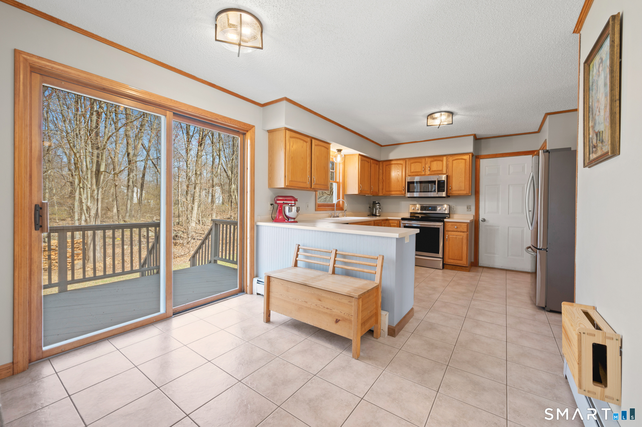 16 Gardner Tavern Road Coventry, CT 06238 - Photo 5 of 40 The dedicated, informal dining area has sliders leading to the deck. What better space to enjoy dinners....