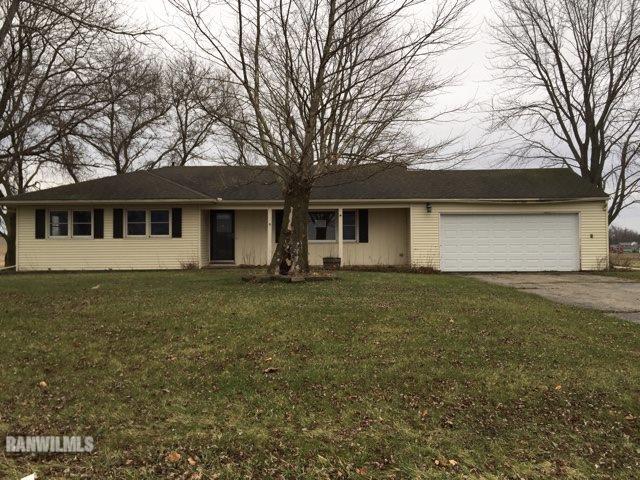 12995 Center Road Durand, IL 61024 - Photo 1 of 14 a view of a yard in front of a house with large trees