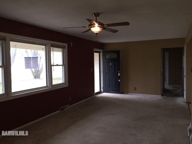 12995 Center Road Durand, IL 61024 - Photo 4 of 14 a view of a livingroom with a ceiling fan and window