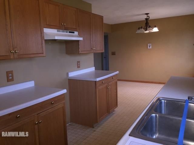 12995 Center Road Durand, IL 61024 - Photo 6 of 14 a room with cabinets and wooden floor