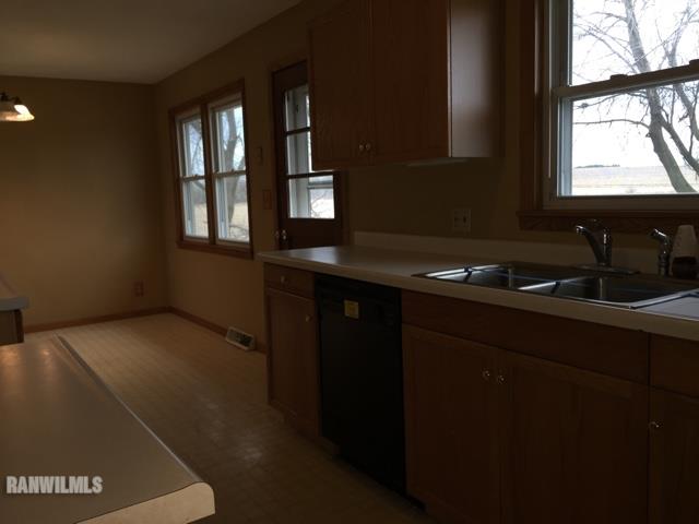 12995 Center Road Durand, IL 61024 - Photo 7 of 14 a kitchen with a sink a window and cabinets