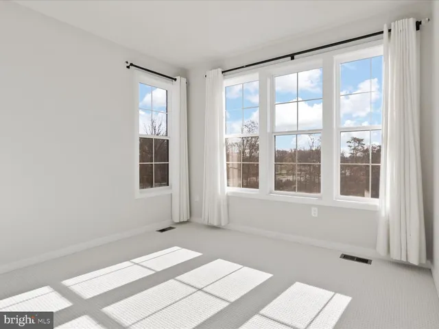 a bathroom with a double vanity sink toilet mirror and shower