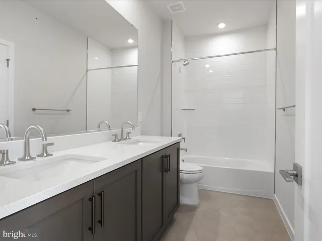 a bathroom with a bathtub and a window