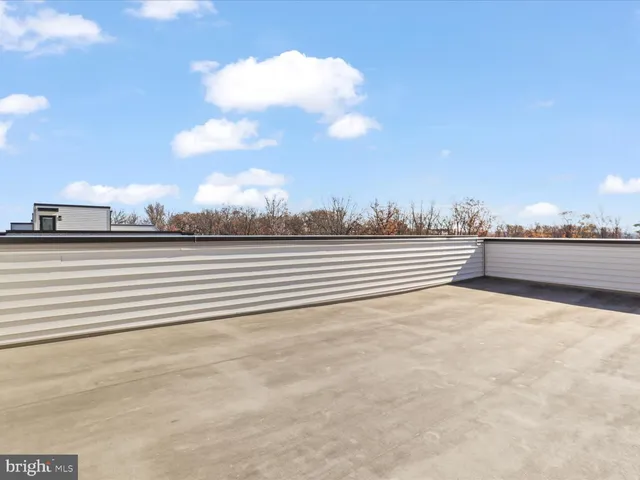 a view of staircase with white walls and windows