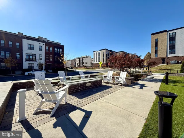 a view of a house with a yard porch and sitting area