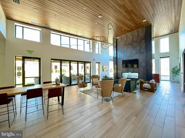 a view of kitchen island with furniture and wooden floor
