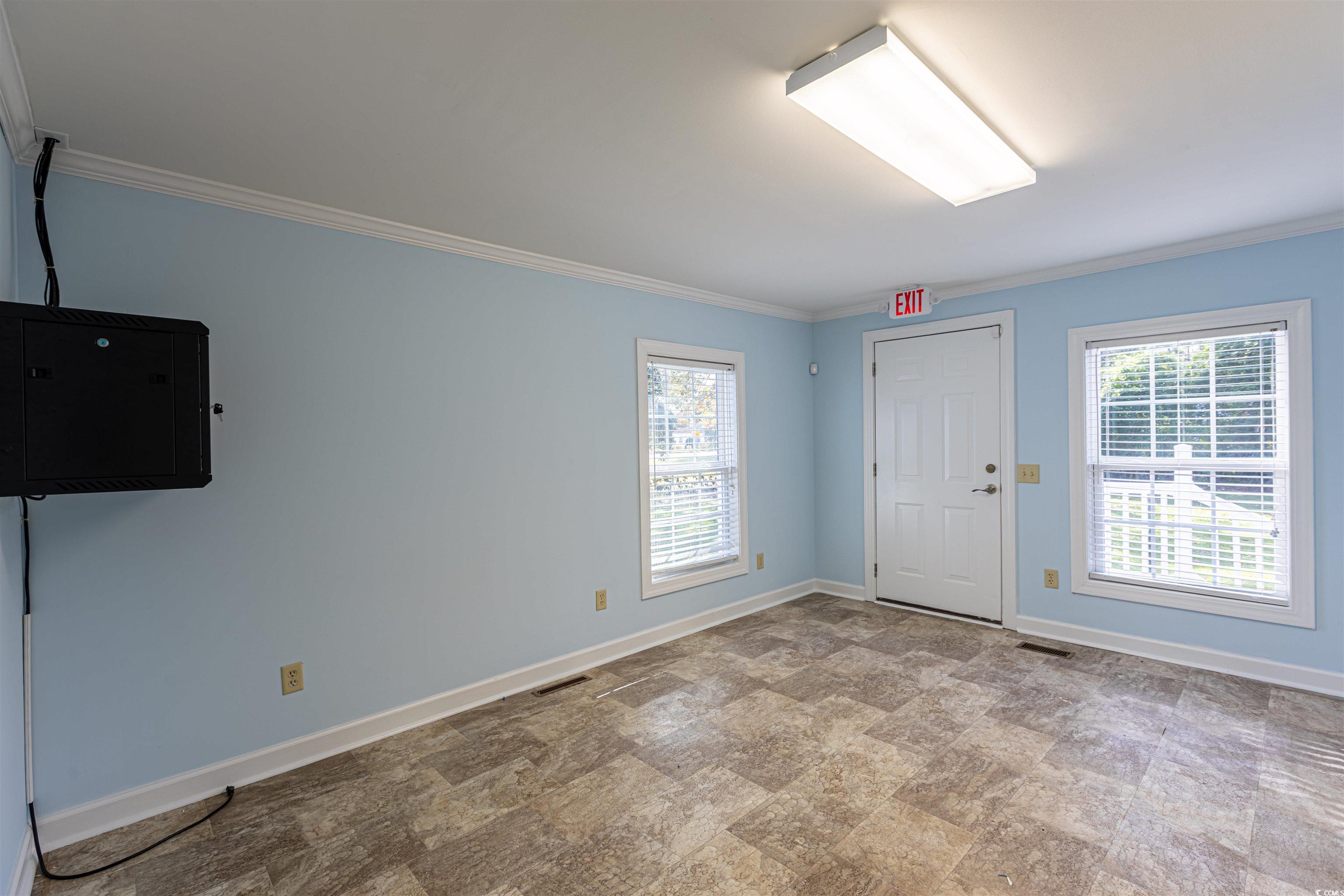 505 North Longstreet Street Kingstree, SC 29556 - Photo 13 of 34 Foyer entrance with crown molding and stone finish flooring
