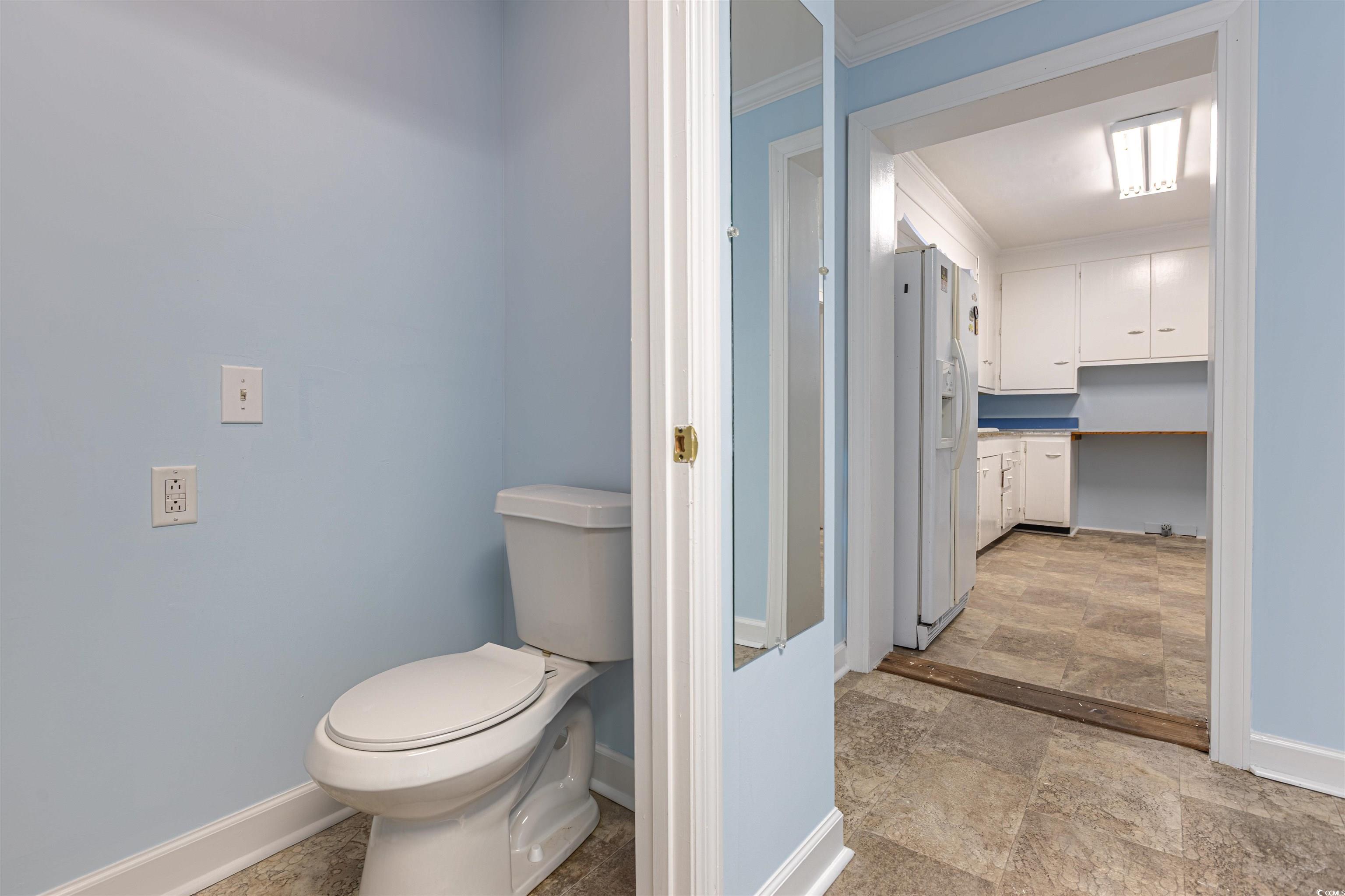 505 North Longstreet Street Kingstree, SC 29556 - Photo 16 of 34 Bathroom with crown molding and stone finish flooring